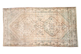 Distressed Northwest Persian hand knotted carpet, ivory, apricot, and charcoal double medallion.