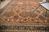 Terra cotta field detail of Vintage Mahal carpet with scrolling vinery and multi-tone border.