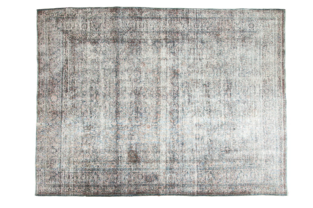 Distressed Meshed Persian carpet with patina denim blue and pale apricot floral design.