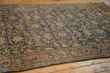 Vintage Persian Meshed rug corner, navy golfarang field, and blush antique ivory border.