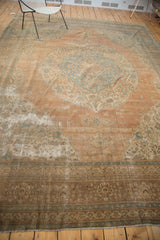Antique Tabriz carpet's heavily distressed border showcasing fine patina, wooded shades, and apricot tones.