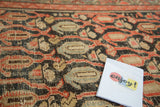 Distressed paisley boteh and vinery pattern in madder root red, dark navy, and beige.