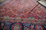 Elaborate palmette and ribbon leaf motifs on the jet black border of the Fine Yezd Carpet.