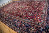 Fine Yezd carpet: black cherry wine red field, jet black border, and elaborate palmette motifs.