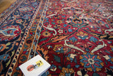 Flowing palmette and ribbon leaf motif on vintage Yezd carpet's wine red field.