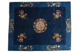 Vintage Peking carpet with cobalt blue field, circular medallion, lotus, chrysanthemum and cloud bands.
