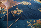 Vintage Peking rug with cobalt blue field, terra cotta lotus flowers, and cloud bands.
