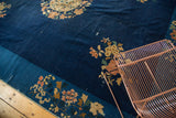 Vintage Chinese Peking carpet section with cobalt blue field, sky blue border, and blooming florals.