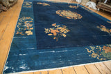 Vintage Chinese Peking rug with cobalt blue field, curvilinear lotus and chrysanthemum border.