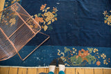 Vintage Peking carpet's border showing terra cotta lotus, pistachio green, and ivory fringe.