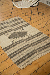 Vintage hand-knotted Kurdish rug corner with ivory and charcoal banded stripes, light tatter.