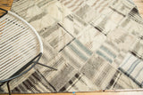 Ivory, coffee brown, and charcoal diamond-shaped patchwork panels with diverse patterns and blanket stitching.