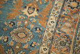 Antique Jalili Tabriz rug detail: curvilinear serrated leaves in sky blue and tangerine.