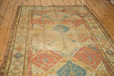 Antique Soumac carpet, multi-paneled lattice in terra cotta, gold, blue, showing even wear.