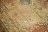 Antique Soumac carpet detail: geometric lattice, exposed foundation, and visible patch.
