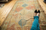 Textured antique Soumac carpet, lattice panels with garden of paradise motifs.