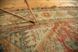 Antique Soumac carpet with multi-paneled geometric flatweave in rust, gold, seafoam green.