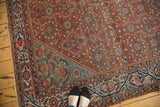 Traditional Mission Malayer rug corner with madder root red and seafoam aqua shadow design.