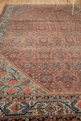 Malayer rug corner detail: madder root red field, floral motifs, pale aqua and indigo borders.