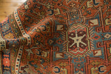 Hand-knotted Karaja rug with stylized geometric and floral patterns in madder red, sky blue.