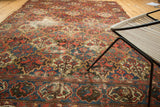 Vintage Baktiari carpet: scalloped panels with germinating trees, love birds, and exposed foundation wear.
