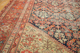 Detailed hand-knotted motifs on antique Malayer rug, with deep blue and sandy contrasting fields.