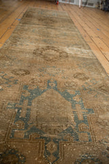 Geometric medallion motifs and distressed texture on a vintage Karaja rug runner.