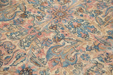 Detail of vintage Lavar Kerman rug, intricate blush, blue, brown floral patterns on ivory.