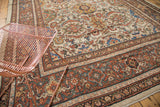 Vintage Mahal carpet border and field, showcasing rust, charcoal, and ivory patterns with patina.