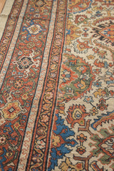Mahal carpet: patterned border, ivory field with blue floral motifs, and pile wear.