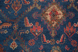Vintage Kurdish Hamadan rug showing detailed Herati pattern, indigo blue pile, and even wear.
