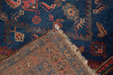 Hand-knotted reverse and indigo blue Herati pattern on a vintage Kurdish Hamadan rug corner.