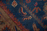Vintage Kurdish Hamadan rug: indigo blue field, brown border, Herati motifs, textured pile.