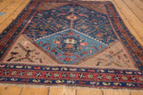Unique asymmetric vase planter motif on a vintage Kurdish Hamadan rug's end.