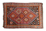 Vintage South West Persian hand-knotted carpet, vibrant aubergine, navy, and tangerine geometric design.