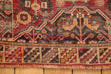 Vintage Sirjan rug border with geometric mountain design, fringe, cherry red, charcoal.