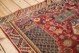 Charcoal lattice fill against a cherry red field with playful floral cross-sections.