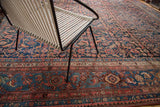 Vintage Persian Bijar carpet detail: navy Herati pattern, classic blush border, softened pile.
