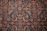 Vintage Persian Bijar rug close-up: allover Herati motif in navy, blush, celadon, showing mostly even wear.