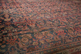 Vintage Bijar carpet featuring Herati motif in navy, blush, celadon, and sky blue palette.