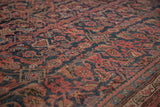 Repeating Herati motif and classic border in navy, blush, and subtle celadon vintage carpet.