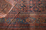 Vintage Bijar carpet's main border featuring half-flipped samovar motifs in navy, blush, and celadon.
