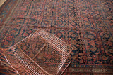 Allover Herati motif field with classic main border on a vintage Bijar carpet.