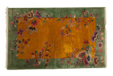 Vintage Nichols Art Deco rug with rich gold field, pistachio border, blossoming floral design. 3' x 4'9
