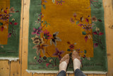 Pistachio border surrounding Art Deco gold field with intricate speckled floral vinery.