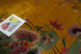 Speckled weave of gold, pistachio, and mauve blossoming flowers on a vintage Nichols Art Deco rug.