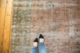 Distressed vintage Sarouk design rug, blush and sky blue floral vinery with wear.