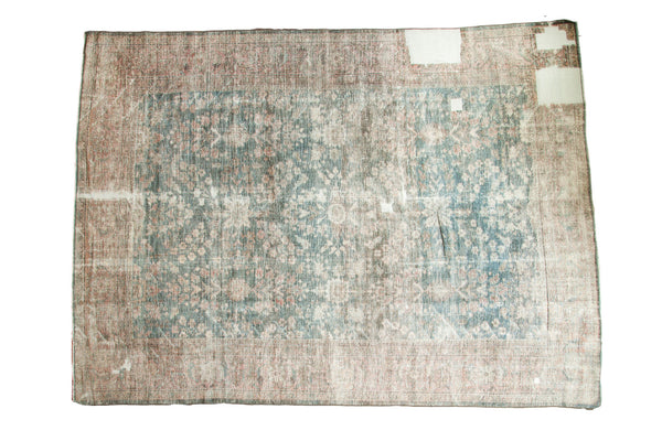 Distressed Mahal carpet, allover faded floral pattern in dusty teal and blush with mostly even wear.