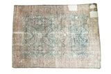 Distressed Mahal carpet, allover faded floral pattern in dusty teal and blush with mostly even wear.
