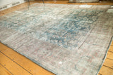 Distressed hand-knotted Mahal carpet with mostly even wear, showing faded teal and blush florals.